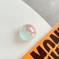 Macro shot of holographic glitter liquid quicksand phone socket with pink and yellow tones - Crystal Ball Bracket - Dreamy Bubble - No. 45