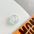Macro shot of circular phone grip featuring iridescent colorful sequins inside resin - Crystal Ball Bracket - Dreamy Bubble - No. 53