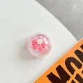 Macro detail of laser crystal phone grip featuring 3D pink bow and white resin flowers - Crystal Ball Bracket - Dreamy Bubble - No. 46