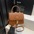 Brown quilted crossbody bag with top handle and golden buckle for women's fashion - Brown