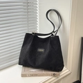 Black oversized tote bag with diamond quilted texture and elegant shoulder straps - Black Without Charm