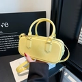 Chic bright yellow patent leather handbag with top handles and adjustable shoulder strap - Yellow