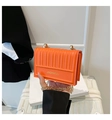 Vibrant orange quilted crossbody bag with a gold chain strap and top handle - Orange