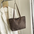 Large leopard print tote bag with brown leather handles on a fashion display hanger - Coffee No Pendant