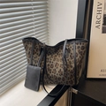 Stylish leopard print tote bag with black leather straps and detachable pouch in sunlight - Leopard Print (Black Accessories) / Black