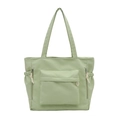 Mint green utility tote bag with large front zipper pocket and drawstring side pouches - Green