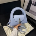 Light blue minimalist handbag with gold U-shaped hardware in a premium black gift box - Blue