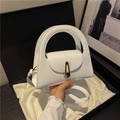Elegant white semi-circle handbag with gold buckle and circular handle in a gift box - White