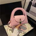Pink semi-circle handbag with golden buckle and crossbody strap on silk lining - Pink