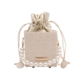 Elegant cream drawstring bucket bag with pearl chain handle and metallic plaque detail - White