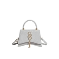 Borsa argento glitterata con base curva e dettagli in metallo dorato su bianco - Argento