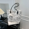 White graffiti tote bag with black cartoon prints and a plush smiley cloud charm - With Ornament / White