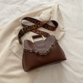 Dark brown tote bag featuring wide geometric print shoulder strap and metal chain detail - Brown