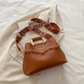 Minimalist caramel brown top handle bag with wide printed strap and metallic chain detail - Brown