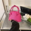 Mini shell-shaped crossbody bag in magenta lychee grain leather with silver chain strap - 15.5cm x 12cm x 7cm / Rose Red