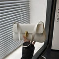 Modern white pebbled leather handbag with gold metal lock and shoulder strap - White