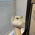 Elegant cream lychee pattern handbag with gold twist lock and versatile strap - White