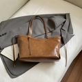 Glossy dark brown oil wax leather tote bag with fine straps on a grey blazer - No Pendant / Brown