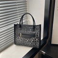 Fashion leopard print tote bag with black handles and gold zipper detail for women - Black