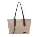 Beige canvas tote bag with brown leather straps and fashion label in a front view - White & Coffee