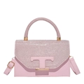 Pink rhinestone handbag with golden T-logo and adjustable strap on white background - Pink