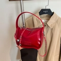 Fashionable red hobo shoulder bag with glossy leather, silver chain and metal ball charm - Red