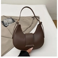 Detail of dark brown hobo shoulder bag with adjustable strap and golden metal buckle - Coffee