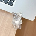 Close-up of a transparent resin bear phone stand with a white 3D heart on a laptop - Adhesive Folding Style / White