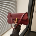 Chic burgundy faux crocodile underarm bag with gold clasp and elegant hand-held strap - Red