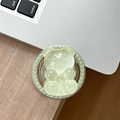 Close-up of a mint green bear phone grip tok with faux pearl beads on a wooden desk - Magnetic Pearl Glitter Bear-Light Green