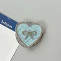 Detalle del soporte de móvil corazón azul claro con diamantes de imitación y lazo - Corazón Lazo Magnético Diamantes-Lentejuelas / Azul