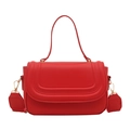 Red solid flap square bag with wavy embossing and wide shoulder strap in a front view - Red