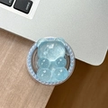 Detail of light blue glittery bear phone grip with pearl-embellished round base on desk - Magnetic Pearl Glitter Bear-Blue