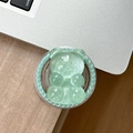 Close-up of light green bear phone socket with pearl inlay on a silver laptop surface - Magnetic Pearl Glitter Bear-Green