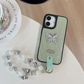 Close-up of light green pleated phone case with rhinestone butterfly and beaded charm - Large Hole Pearl Pattern - Silver Butterfly Logo - White Pearl Chain - Green / iPhone 17 Pro Max