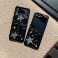 Detail of glitter starry Samsung Z Flip case with large silver rhinestone star and heart - Black Groove - Meteor Glitter - Black Silver Star / Samsung ZFlip3