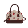 Chic strawberry print shell handbag with cream leather body and dark brown handles - Coffee
