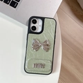 Detail of mint green leather phone case with silver metal bow and 3D min lettering - Large-hole Pearlescent Texture - Matching Mirror Stand - Mini Bow - Green / iPhone 17 Pro Max