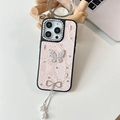 Detail of pink iPhone case with rhinestone butterfly and elegant pearl tassels - Pink / 16e