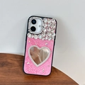 Detail of pink snake leather iPhone case with rhinestone heart mirror and butterfly charms - Rose Red