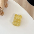 Detail of bear phone grip with golden glitter and star sequins on white surface - Telescopic Stand Style / Yellow