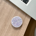 Detail of round purple glitter pop phone socket on wooden desk with silver laptop background - Purple High Shine Sequin