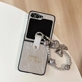 Close-up of silver wrinkled leather phone case with rhinestone letters and beaded charm lanyard - Pearl Texture-Rhinestone Letter M-Star Chain / Silver / Samsung ZFlip7