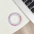 Detail of a purple Good Luck magnetic phone grip stand on a white desktop background - goodluck Magnetic - Adhesive Top / Purple