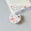 Detailed view of 3D miniature paint palette phone grip with colorful resin pigment blobs - Transparent Stand Style / Pink