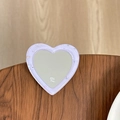 Macro detail of heart-shaped purple glitter mirror phone grip with star sequins and MINE text - Light Purple