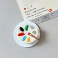 Top view of a white palette phone grip with five colorful 3D paint blocks and a tiny brush - Magnetic Palette Style / White