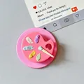 Detail of pink palette phone grip featuring miniature oil paint blobs and tiny brush - Magnetic Palette Style / Rose Red