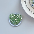 Macro view of green glitter heart phone grip with folding stand and sparkling finish - Magnetic Heart Stand - Light Chasing Green