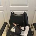 Sleek black faux leather crescent hobo bag with gold fashion lettering and hardware - Black